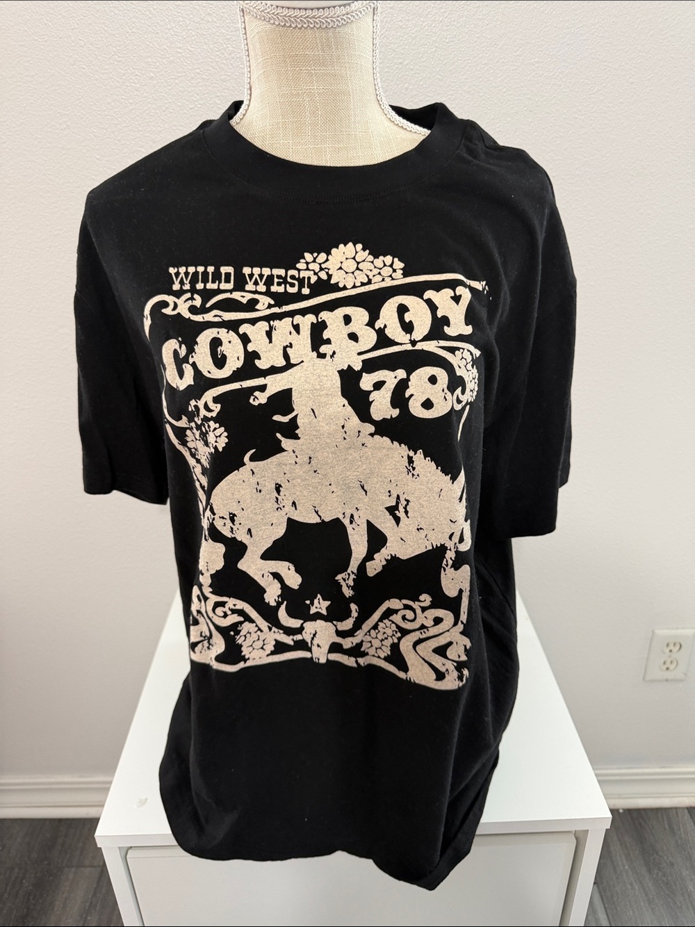 Pink Lily Black Short-Sleeve Tee with Cream Cowboy Graphic